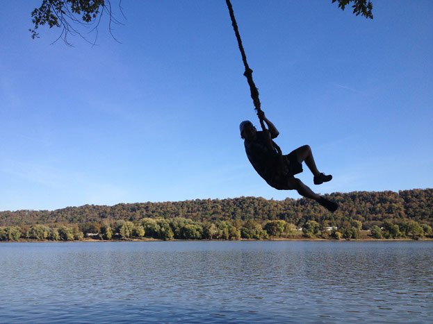 person swinging on a rope